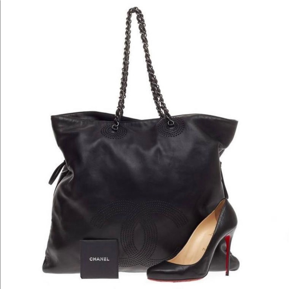 This authentic Chanel Bon Bon Tote Studded Leather